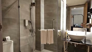 Shower, hair dryer, slippers, towels
