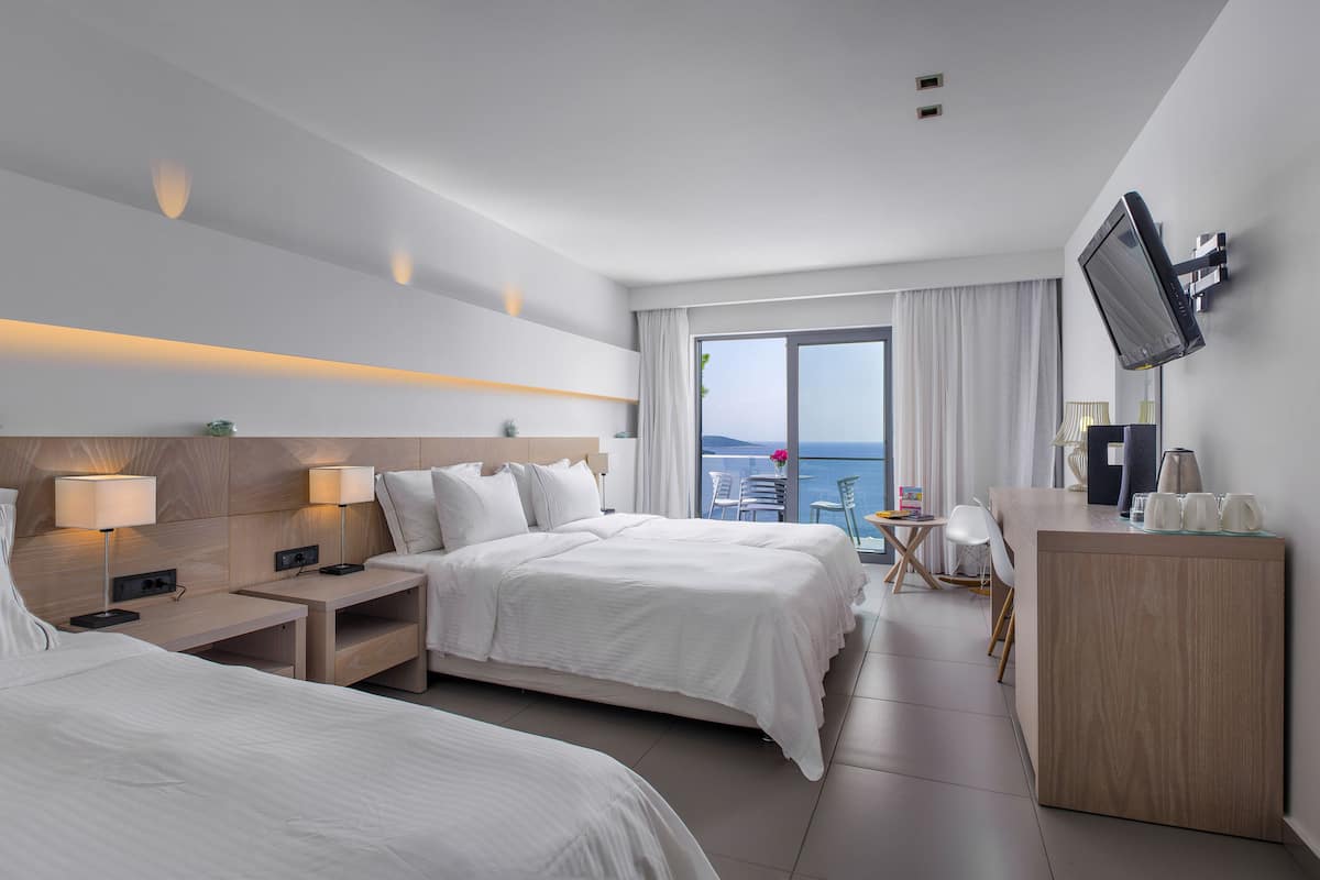 standard triple room, sea view | in-room safe, desk, blackout curtains, soundproofing