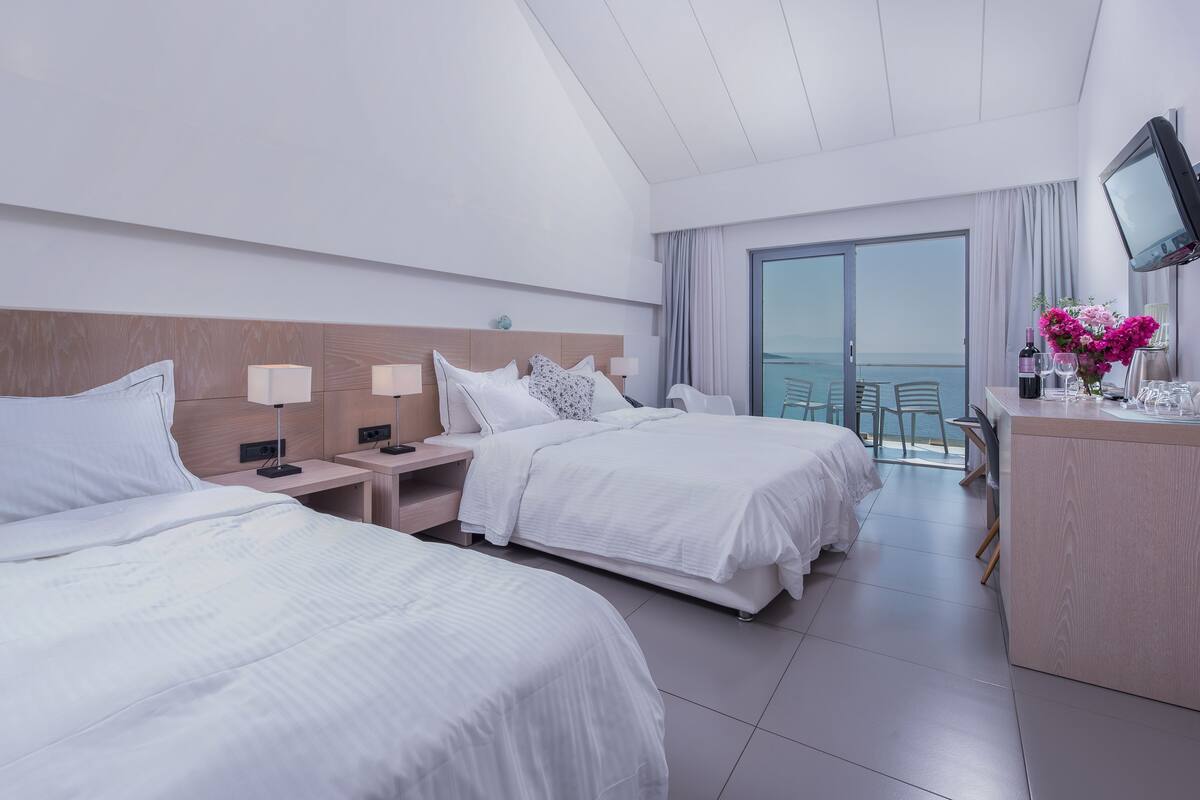 Sea View Triple Room 1st Floor | Hypo-allergenic bedding available, in-room safe, desk, laptop workspace
