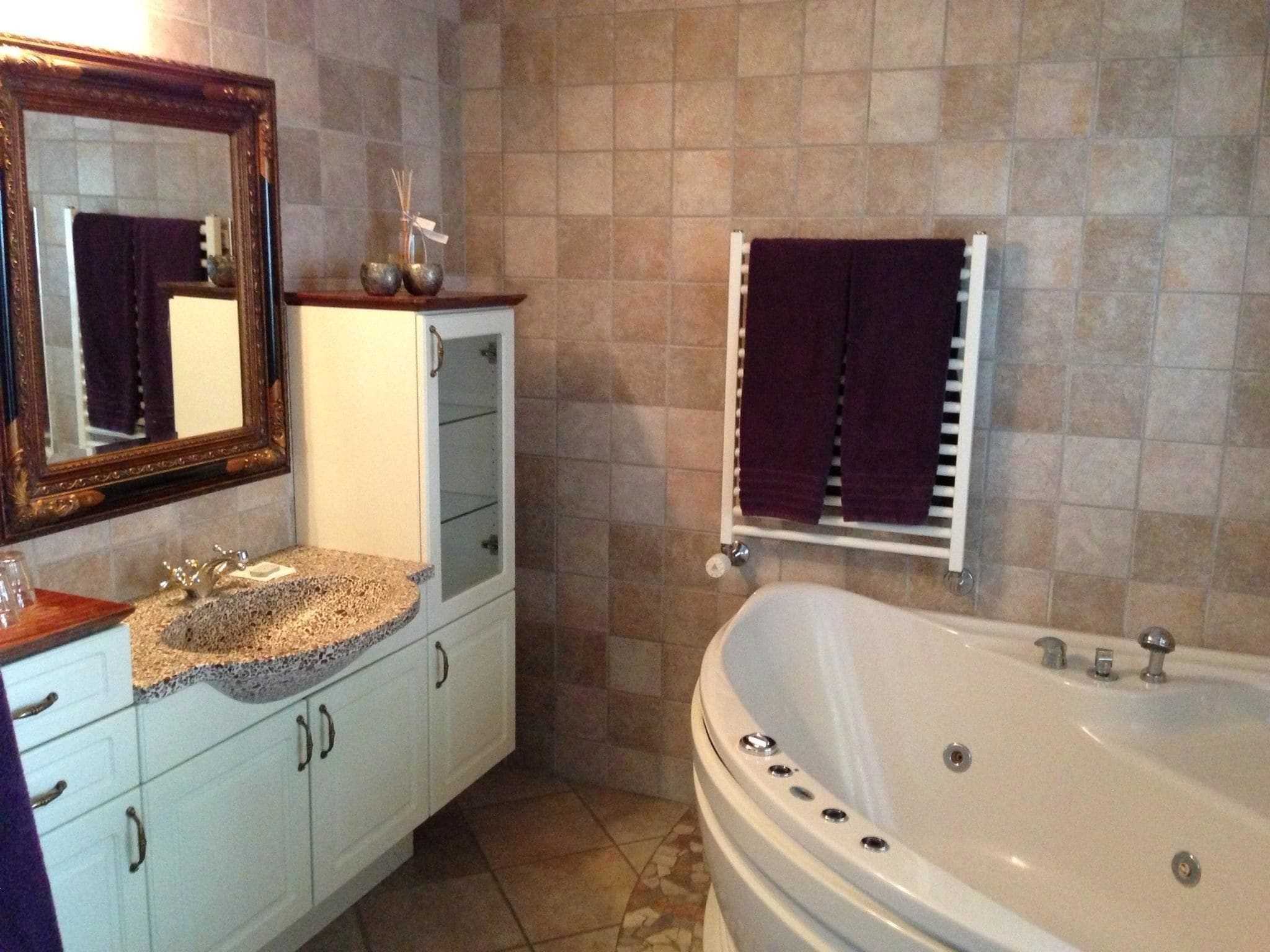 junior suite, jetted tub | bathroom | hair dryer, towels