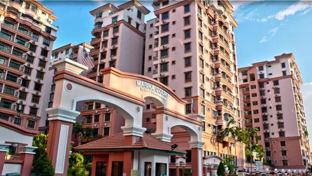 A multi-story hotel with a prominent entrance archway labeled "MARINA COURT." - Jack's CondoApartment @ Marina Court Resort Condominium (Kota Kinabalu)
