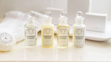 Four bottles of Penhaligon's Blenheim Bouquet on a white countertop.