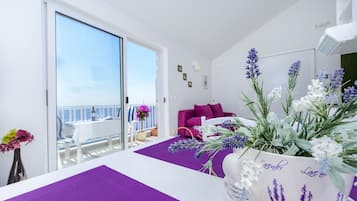 Apartment, Balcony, Sea View (4 persons) | Living area | Plasma TV