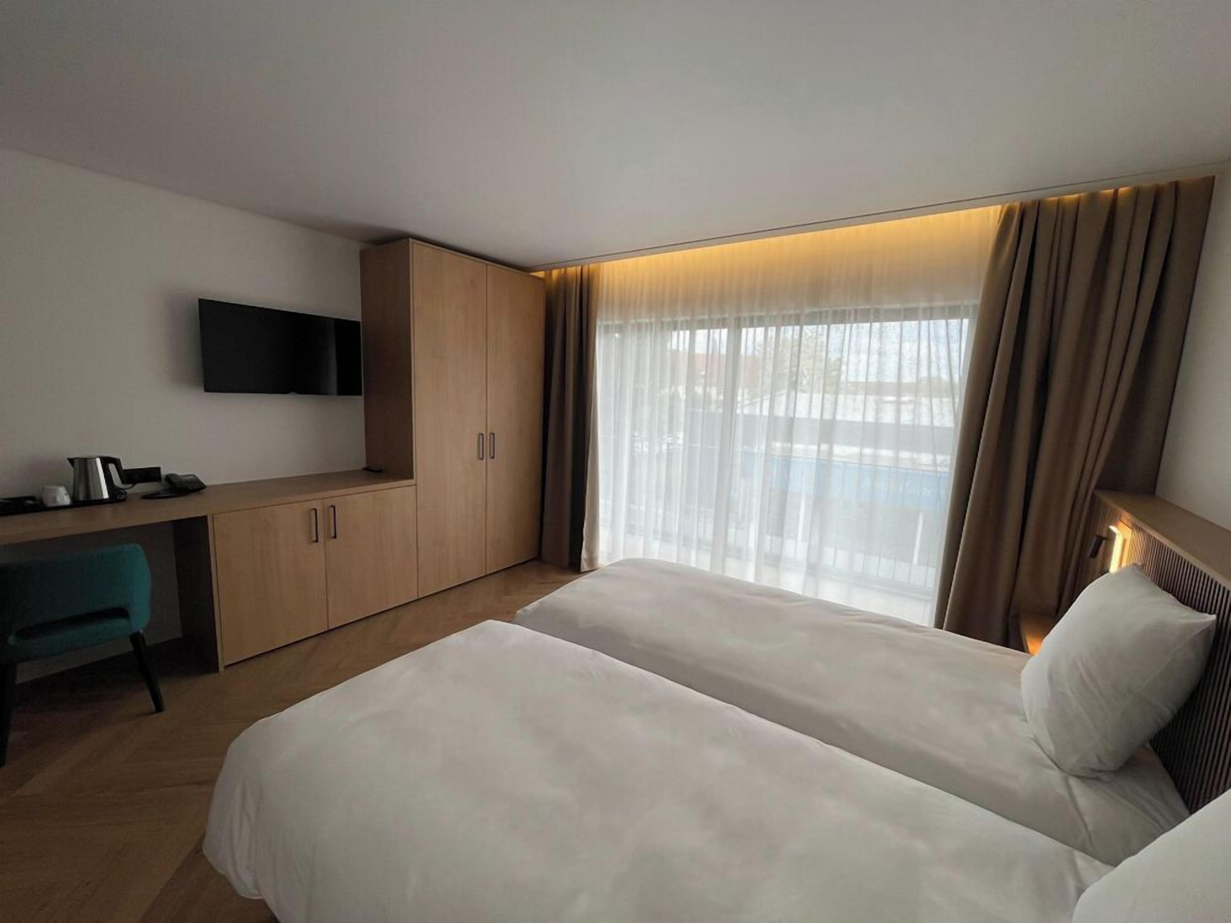 Chambre Deluxe avec lits jumeaux | Wi-Fi gratuit, draps fournis, accès pour personnes à mobilité réduite