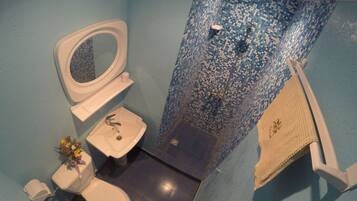 Shower, rainfall showerhead, hair dryer, towels