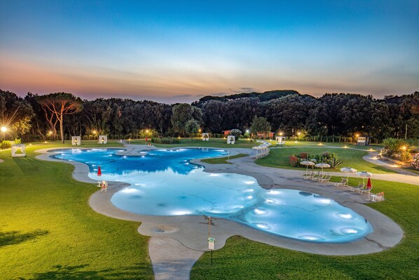 Seasonal outdoor pool, open 10:00 AM to 7:00 PM, pool umbrellas