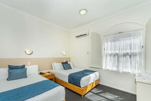 Family Room, Multiple Beds, Non Smoking | Minibar, in-room safe, individually furnished, blackout drapes