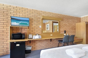 Premium bedding, desk, laptop workspace, blackout curtains