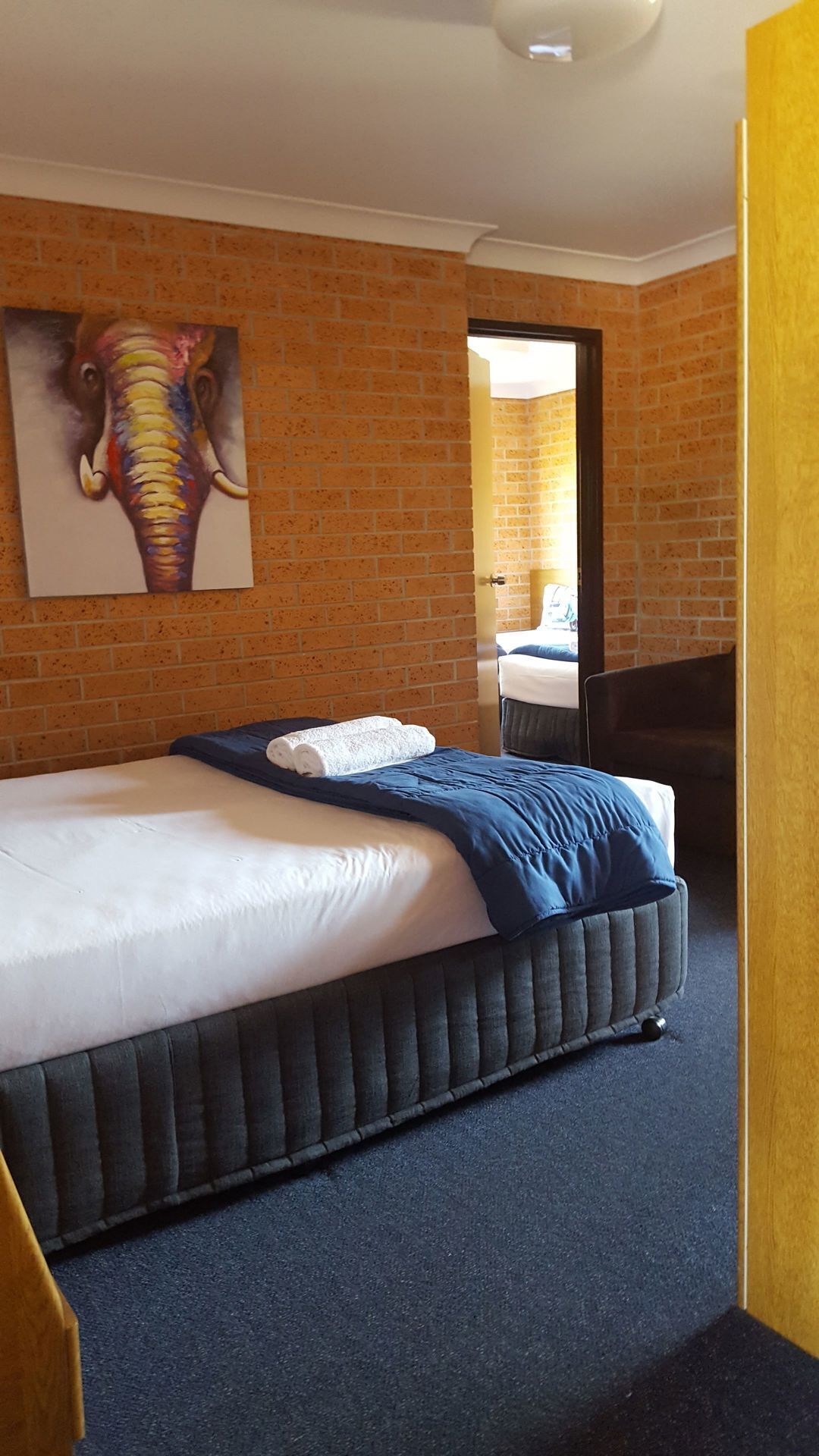 Premium bedding, desk, laptop workspace, blackout drapes