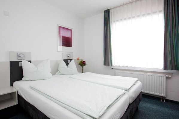 Basic Double Room, City View | Hypo-allergenic bedding, in-room safe, desk, blackout curtains