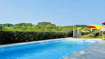 Outdoor pool, open 8:00 AM to 9:00 PM, pool umbrellas, sun loungers