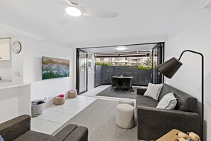 Standard Apartment, 1 Bedroom, Patio, Ground Floor | Living area | 26-inch TV with digital channels