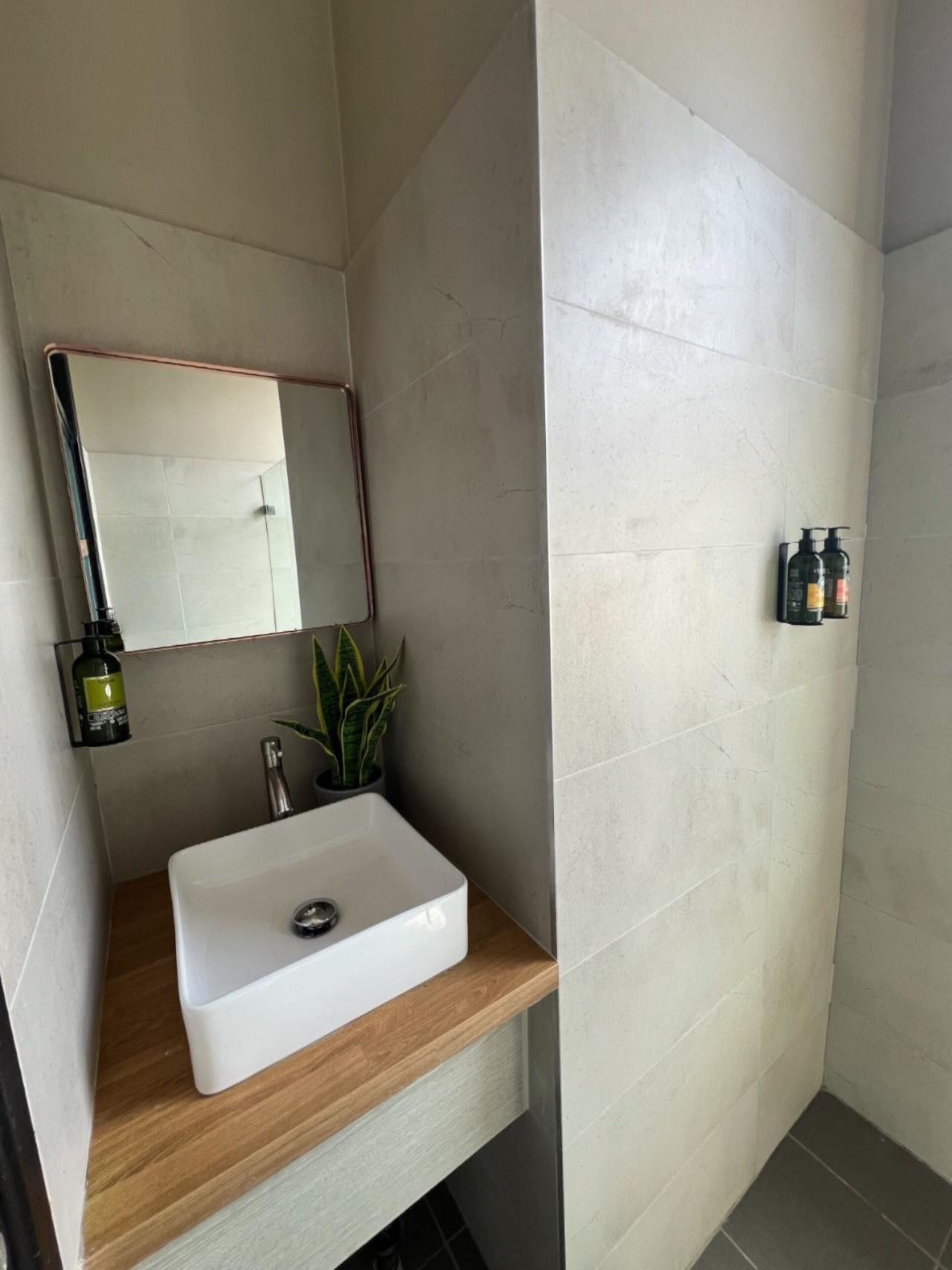 deluxe family room | bathroom | shower, rainfall showerhead, free toiletries, hair dryer