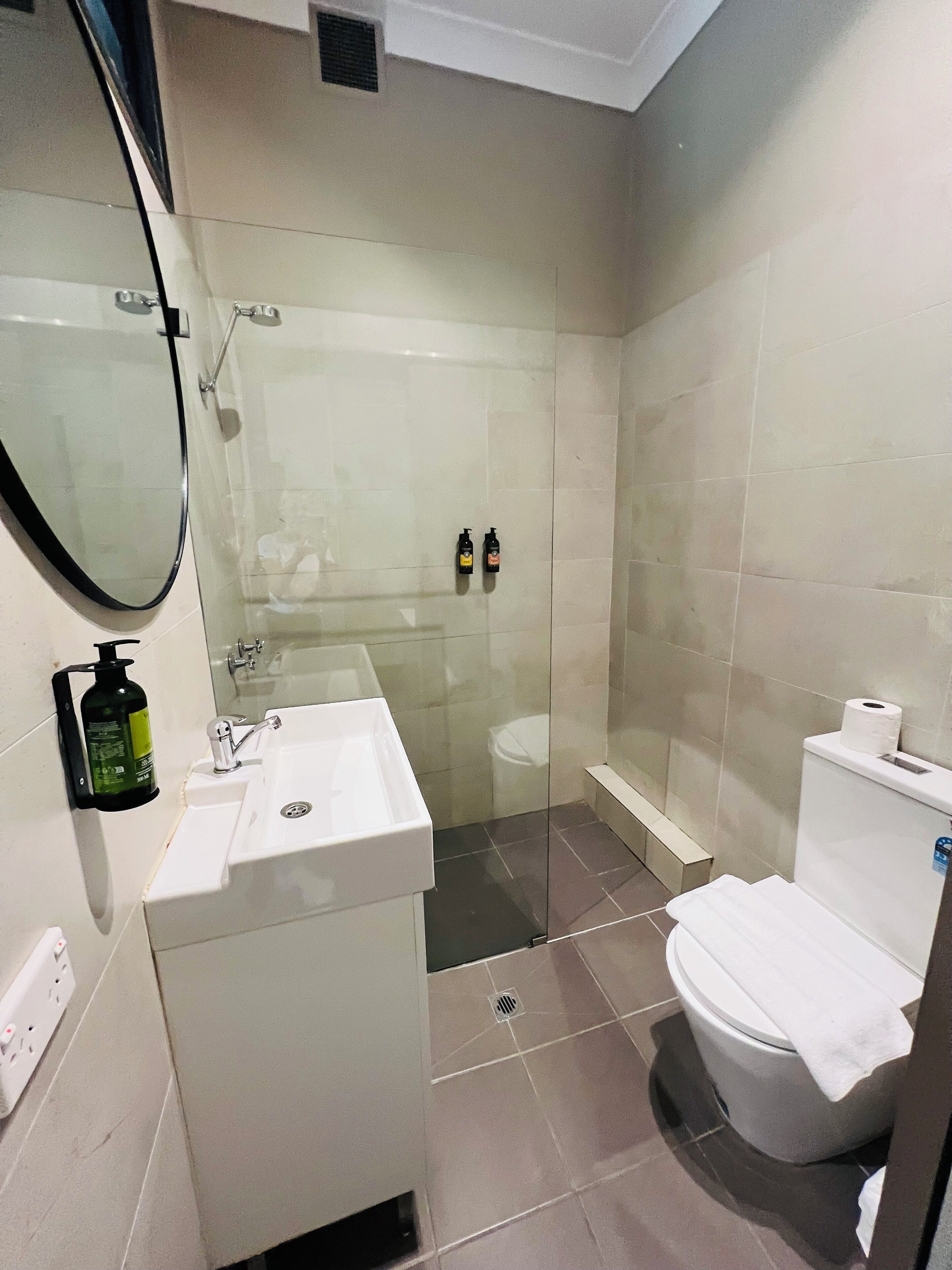 deluxe family room | bathroom | shower, rainfall showerhead, free toiletries, hair dryer