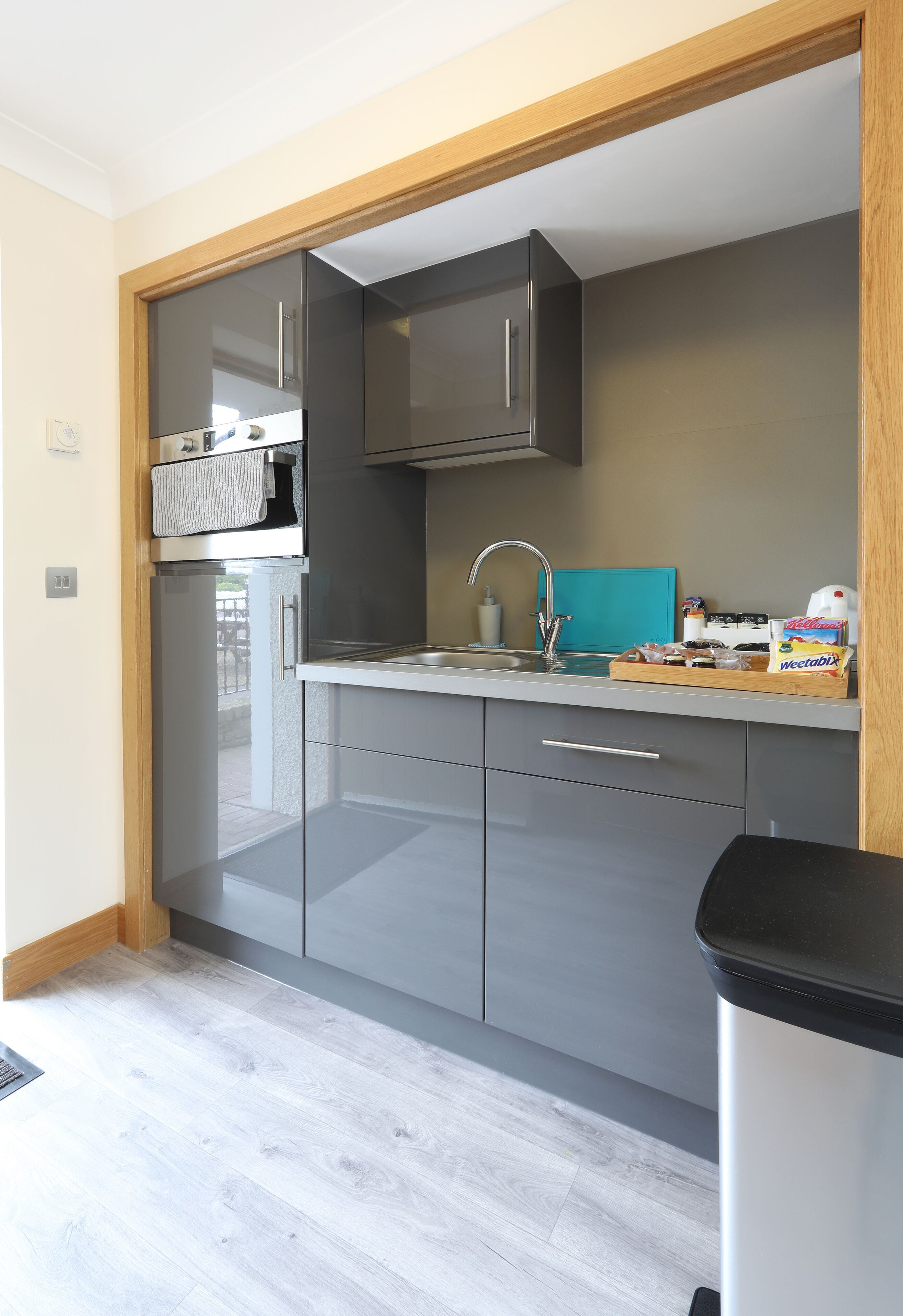 full-sized fridge, microwave, electric kettle, cookware/dishes/utensils