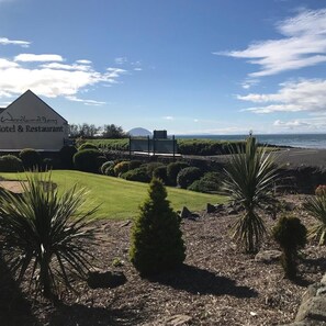 A hotel named Woodland Bay with a view of the beach and landscaped garden. - Woodland Bay Hotel (Girvan)