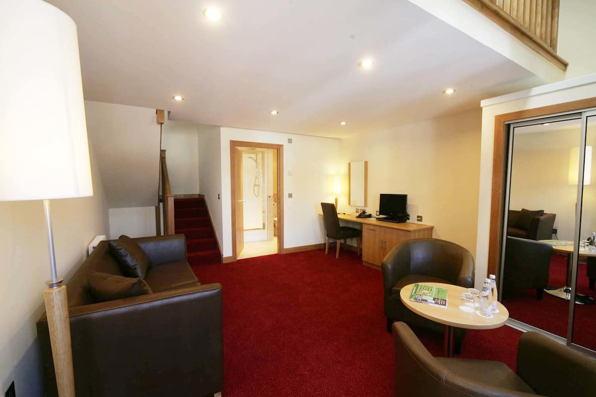 Suite, Mezzanine | Living area | 40-inch flat-screen TV with digital channels, TV