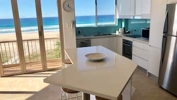 Three Bedroom Apartment Beachfront | Private kitchen | Fridge, microwave, oven, stovetop