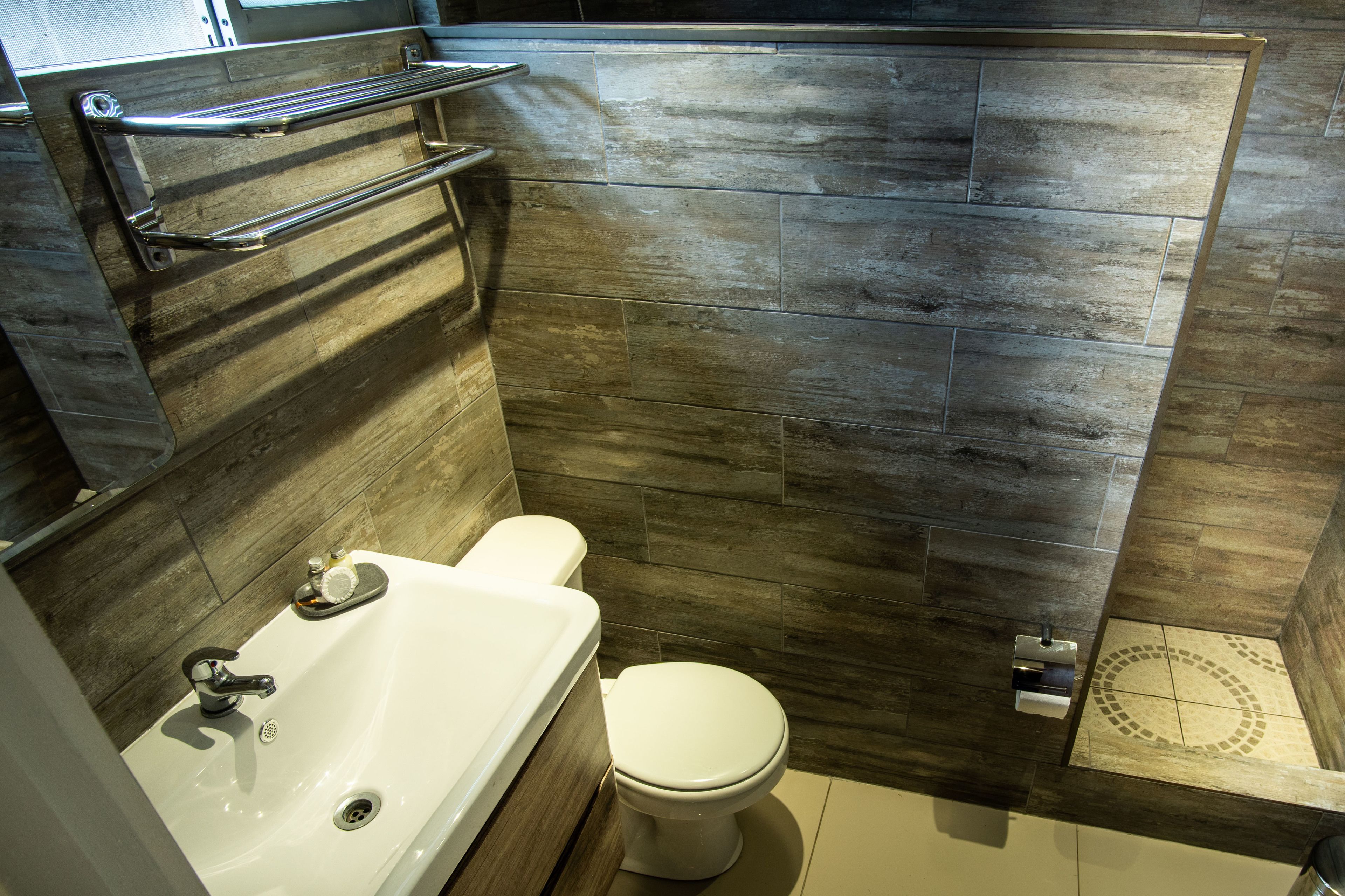 shower, rainfall showerhead, hair dryer, towels