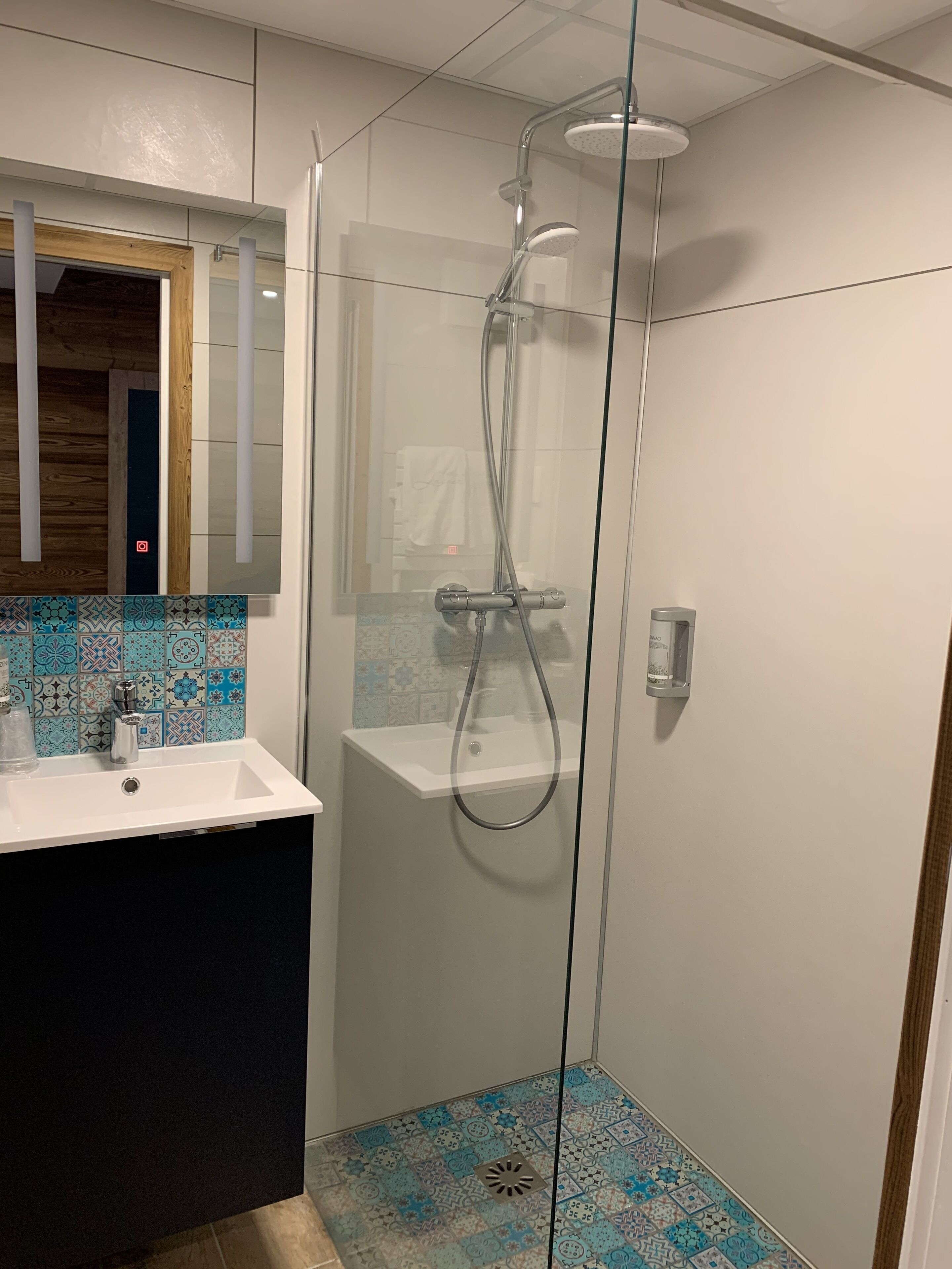 superior double room | bathroom | deep-soaking bathtub, rainfall showerhead, free toiletries, hair dryer