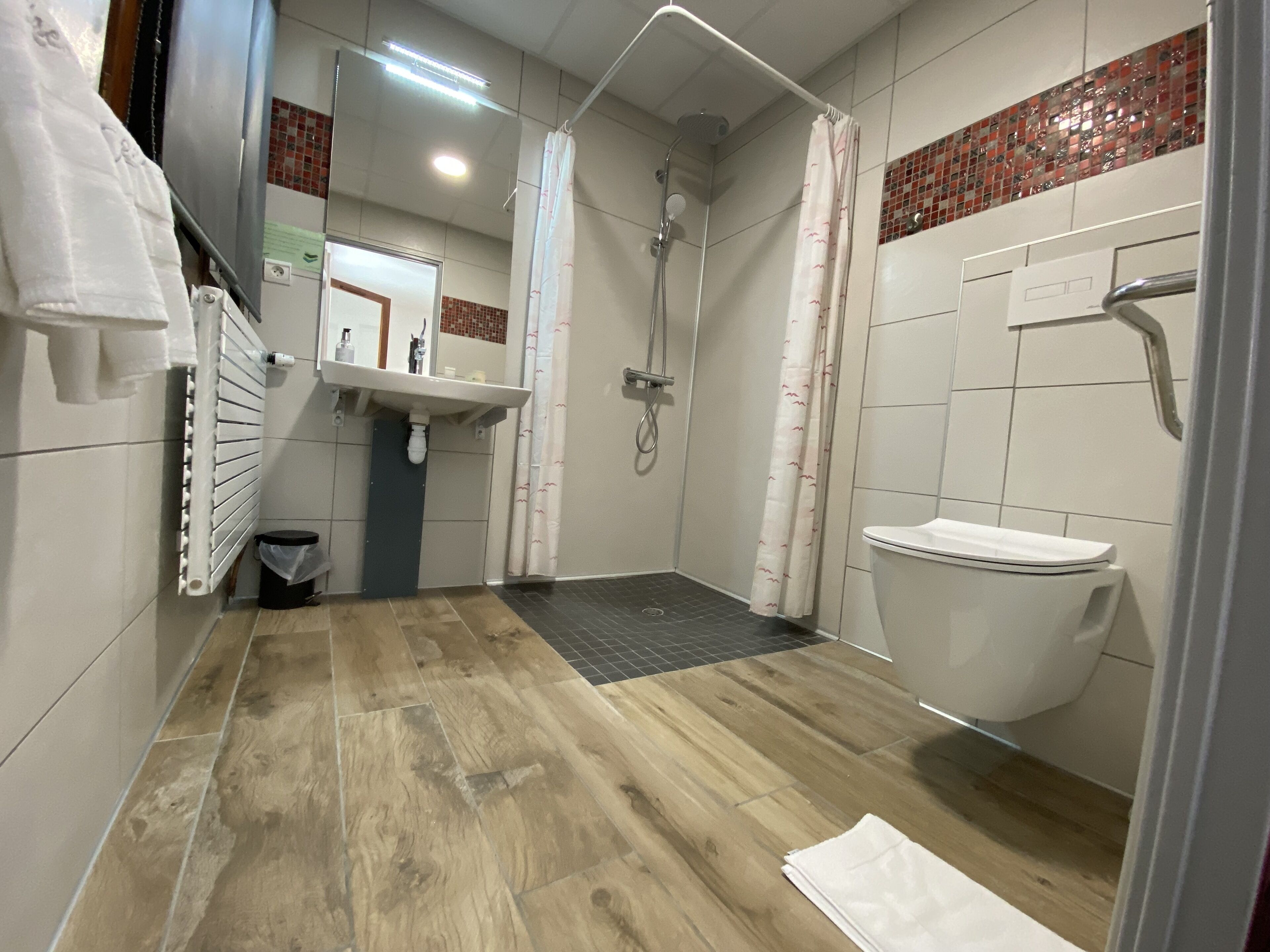 deep-soaking bathtub, rainfall showerhead, free toiletries, hair dryer