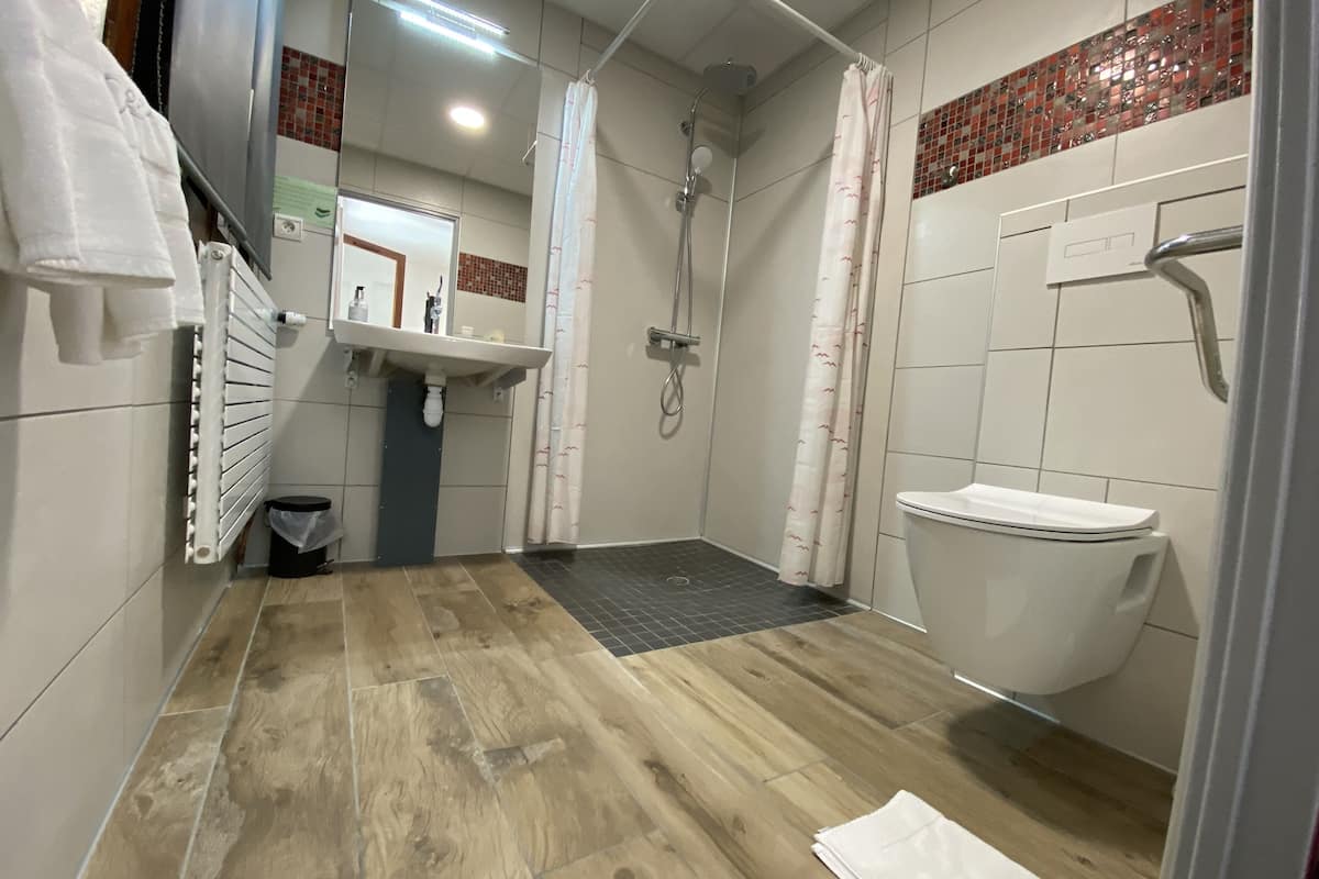 deep-soaking bathtub, rainfall showerhead, free toiletries, hair dryer