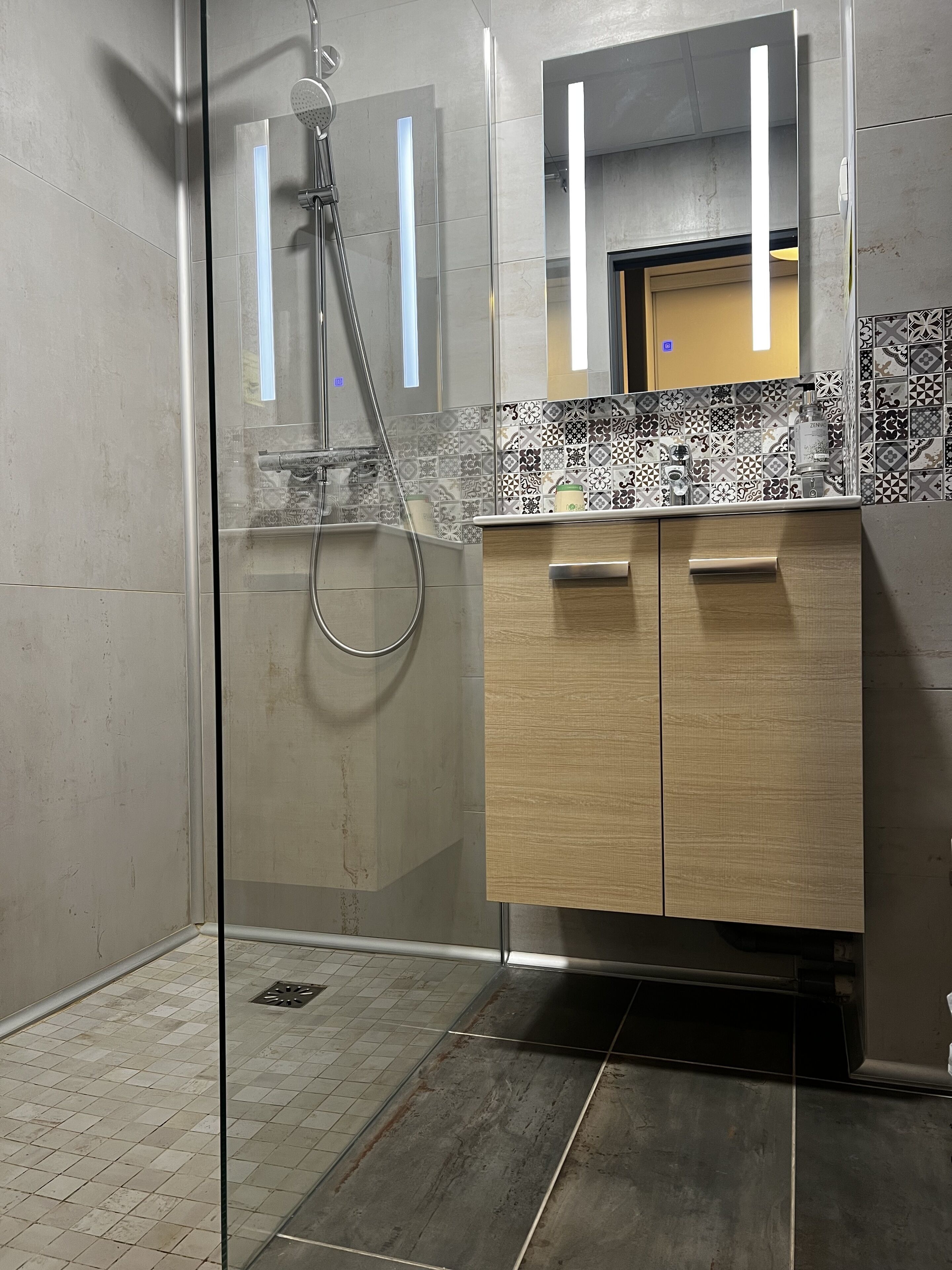 deep-soaking bathtub, rainfall showerhead, free toiletries, hair dryer