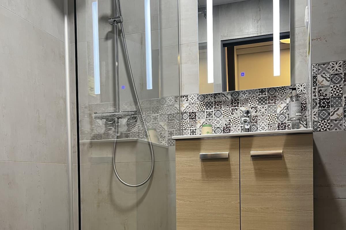 deep-soaking bathtub, rainfall showerhead, free toiletries, hair dryer