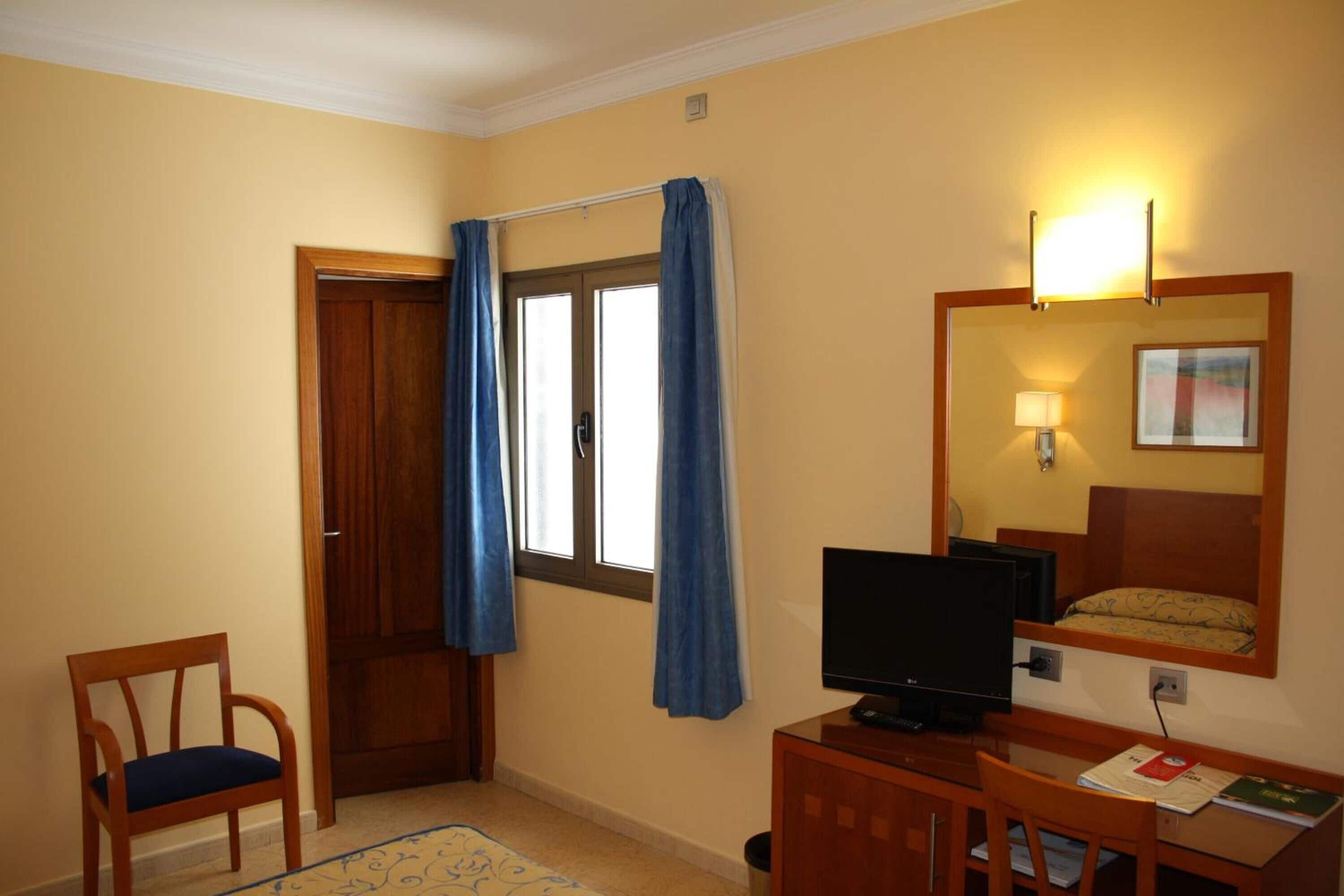 in-room safe, desk, blackout curtains, iron/ironing board