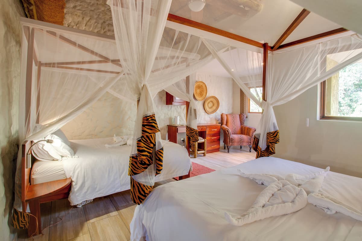 Family Quadruple Room, 2 Double Beds, Garden View | In-room safe, free WiFi, bed sheets