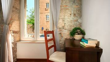 Desk, blackout curtains, soundproofing, free cots/infant beds