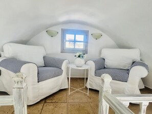 Deluxe Dome With Private Balcony With Sea View | Living area | TV, books - Santorini Mesotopos (Santorini)