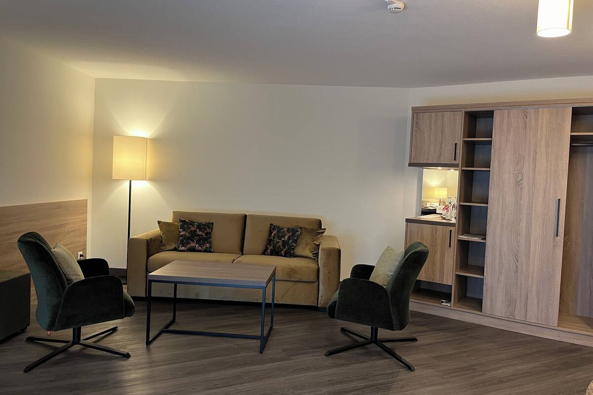 junior triple room | living area | tv