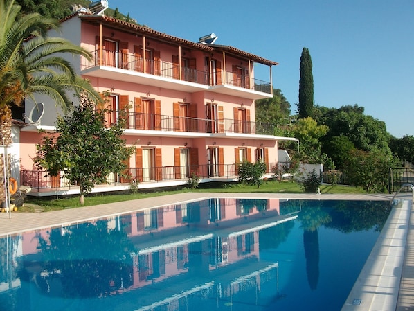Outdoor pool, open 9:00 AM to 7:00 PM, pool umbrellas, pool loungers