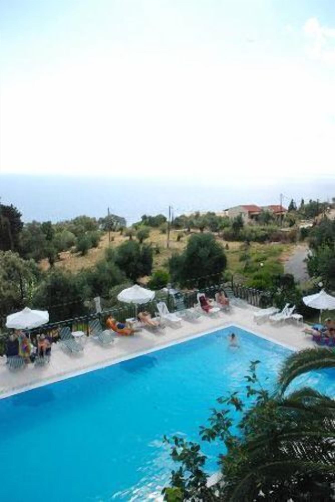 outdoor pool, open 9:00 am to 7:00 pm, pool umbrellas, pool loungers