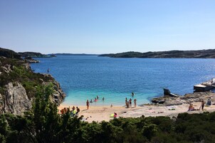 On the beach, white sand, beach cabanas, kayaking