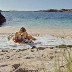 On the beach, white sand, beach cabanas, kayaking