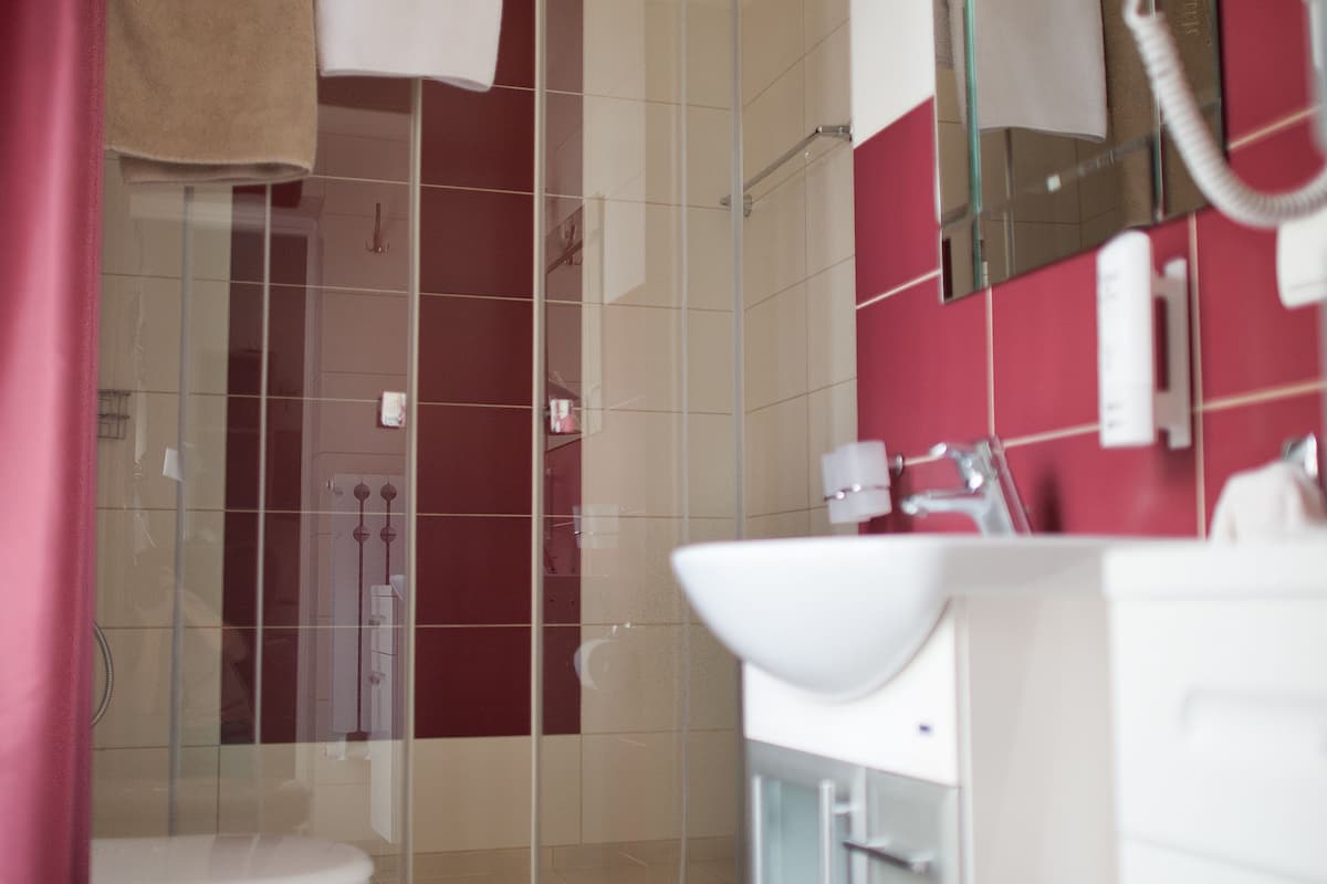 executive double room, garden view | bathroom | designer toiletries, hair dryer, bathrobes, slippers