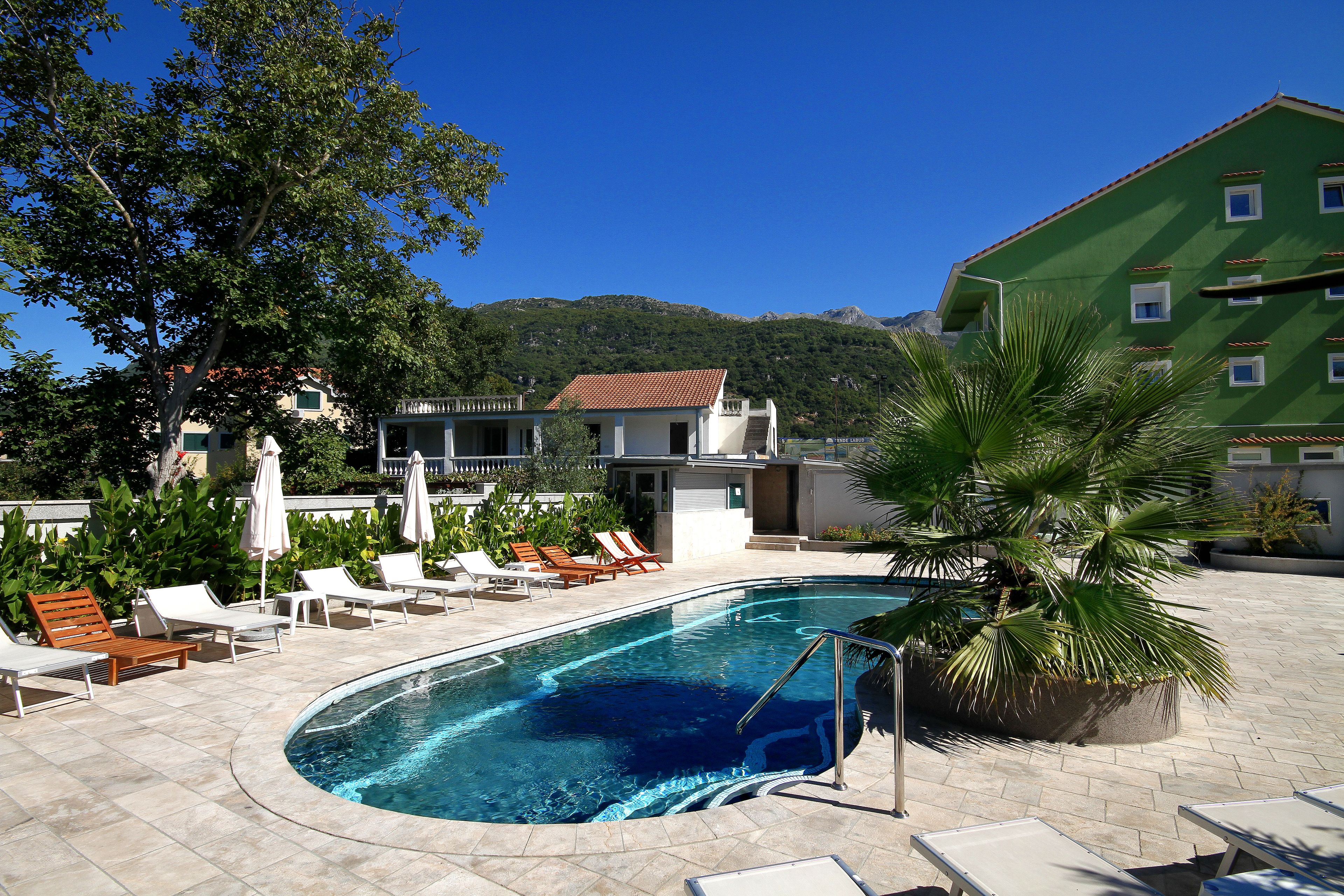 seasonal outdoor pool, open 8:00 am to 11:00 am, pool umbrellas