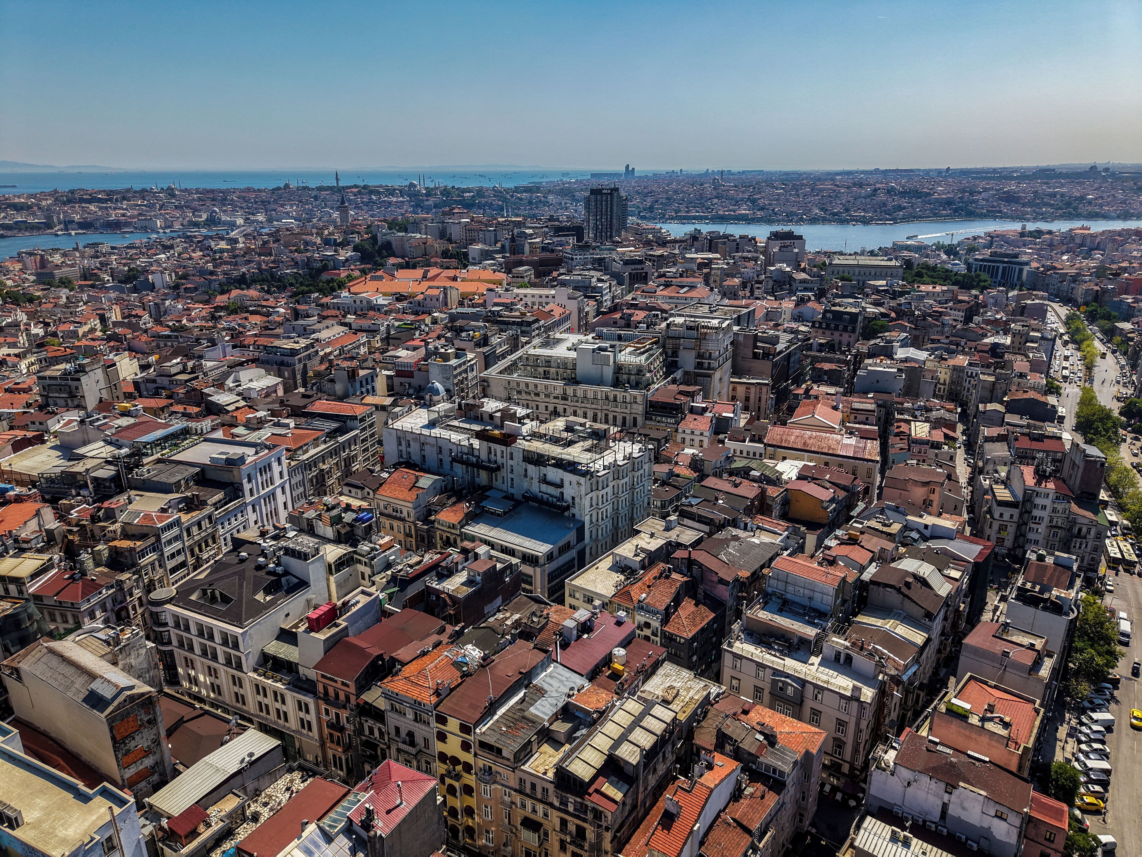 A densely packed urban area with a variety of building styles and a prominent waterfront.
