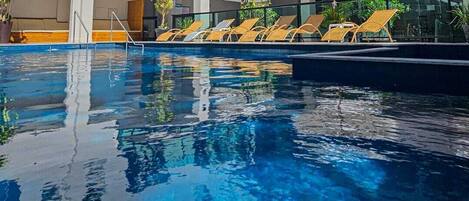 Outdoor pool, open 10:00 AM to 10:00 PM, sun loungers