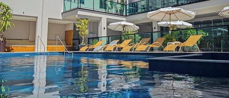 Outdoor pool, open 10:00 AM to 10:00 PM, sun loungers