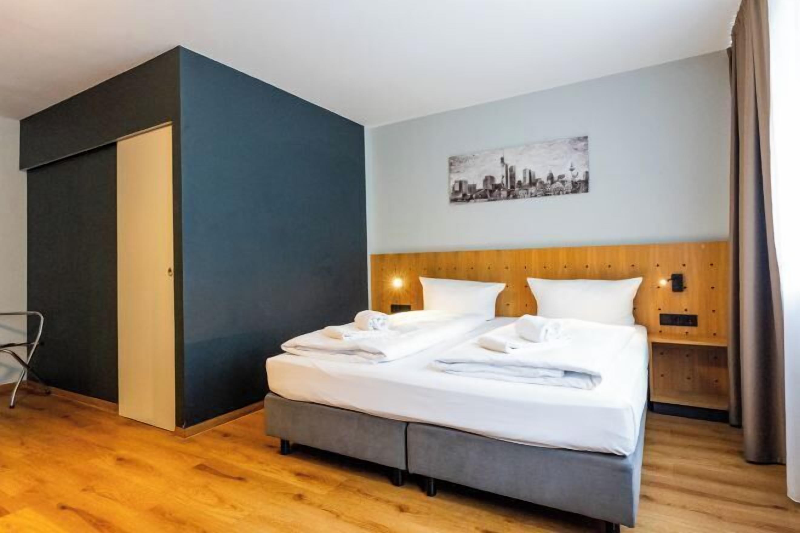 Hypo-allergenic bedding, desk, laptop workspace, blackout curtains
