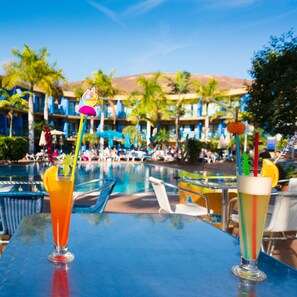 Outdoor pool, open 10:00 AM to 6:00 PM, pool umbrellas, pool loungers