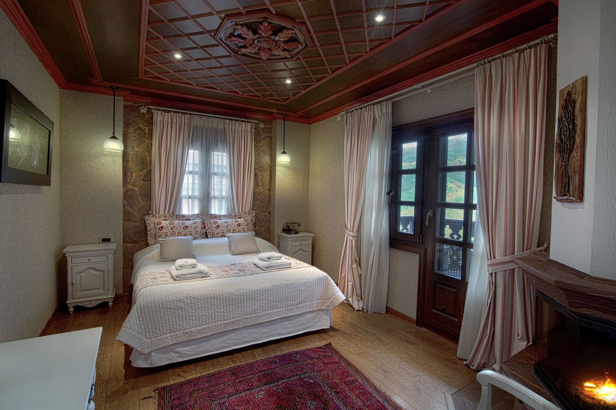 superior double room, fireplace, mountain view | minibar, in-room safe, individually decorated, individually furnished