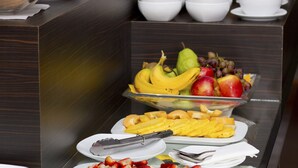A buffet with various food items including fruits, vegetables, and pastries. - Casa Bueras Boutique Hotel (Santiago)