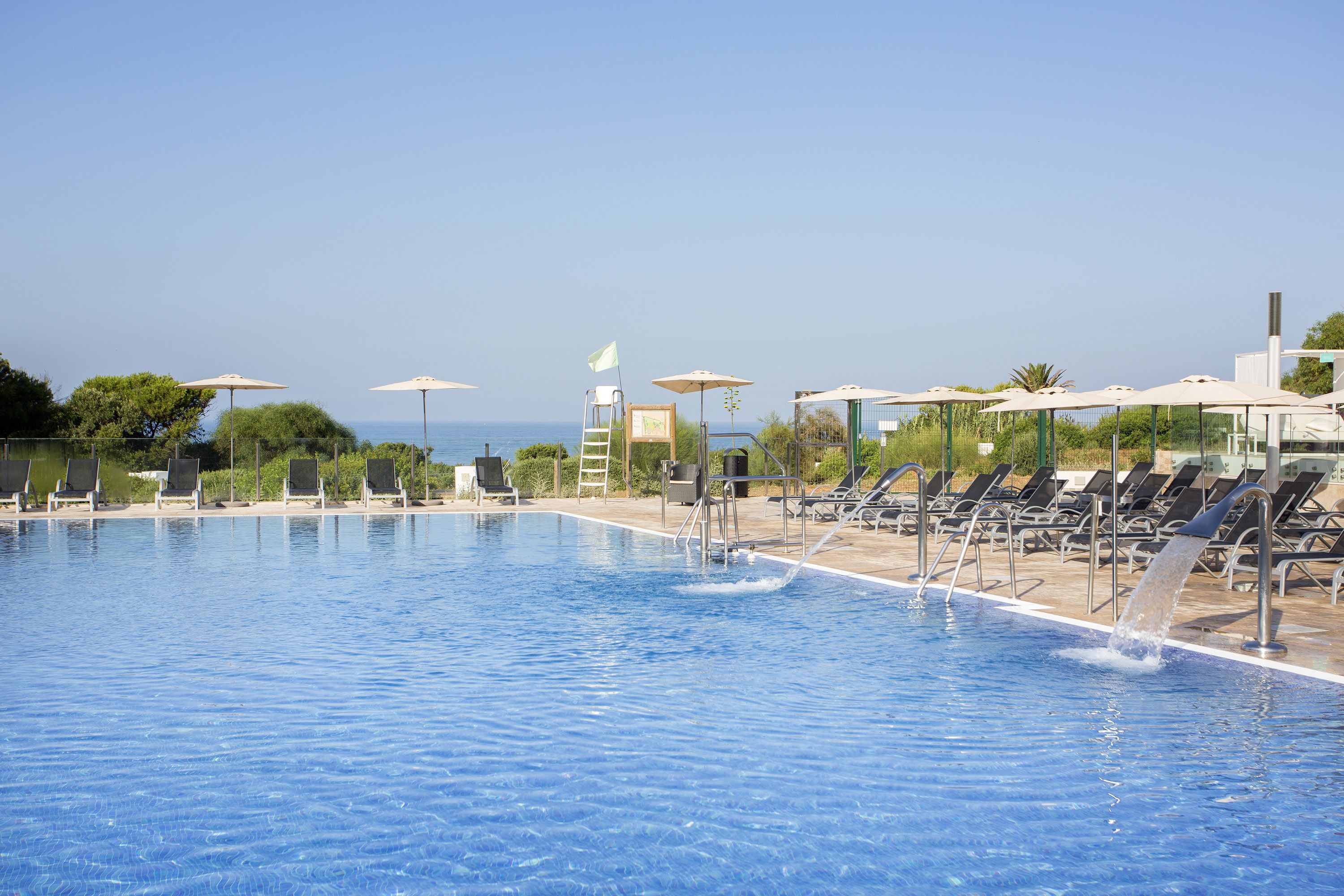 indoor pool, outdoor pool, pool umbrellas, pool loungers