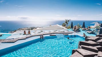 2 outdoor pools, open 9:00 AM to 5:00 PM, pool umbrellas, pool loungers