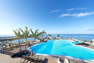 2 outdoor pools, open 9:00 AM to 5:00 PM, pool umbrellas, pool loungers