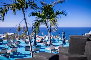 2 outdoor pools, pool umbrellas, pool loungers